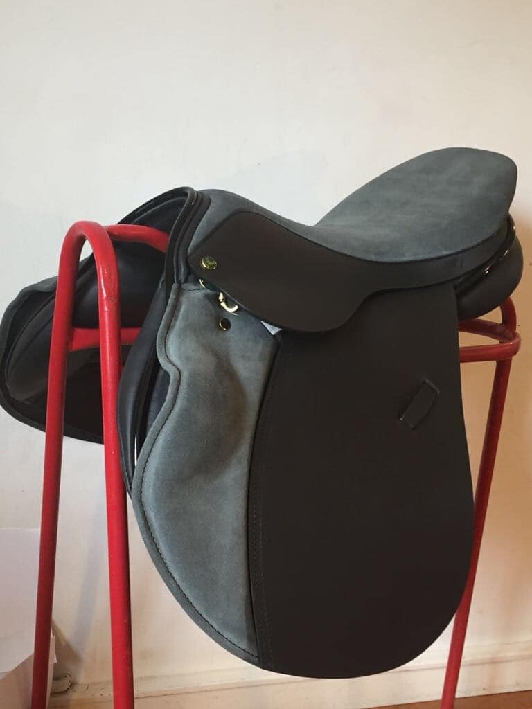 Ideal Impala 1450 Jump saddle in black Kilger leather and Persian suede with patent roll and piping.